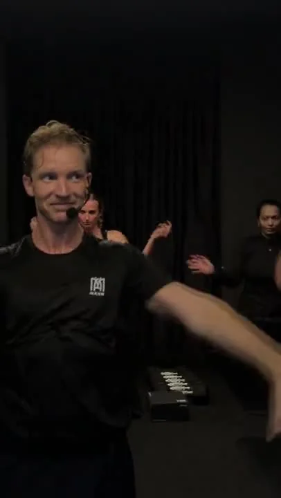 Kenneth smiling and connecting with the group in the studio