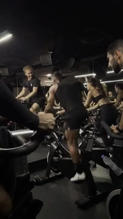Participants cycling together in the studio