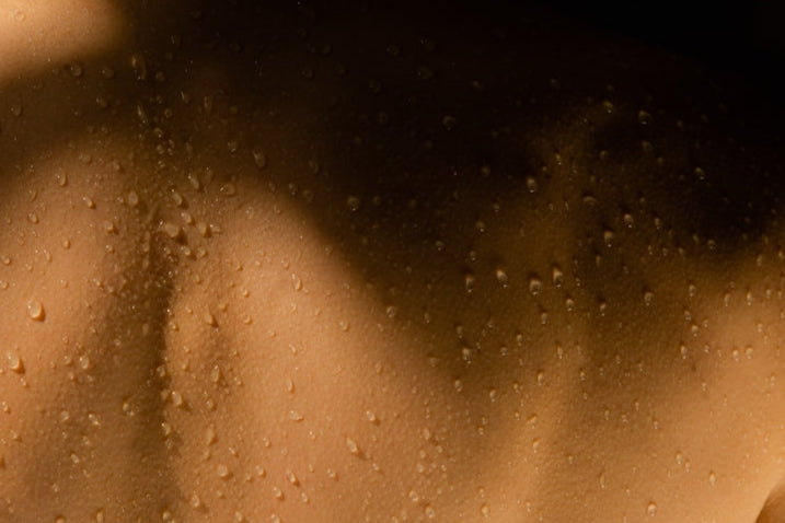 Close-up of a textured brown surface with water droplets.